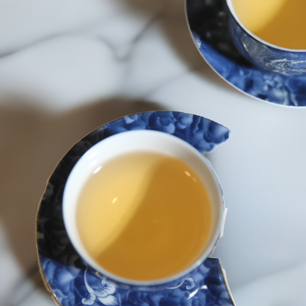 2013 Manzhuan Mountain Pu-erh Raw Tea in a chinese tea cup
