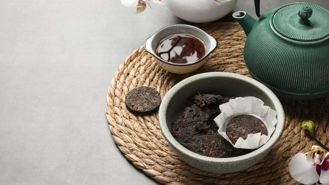 Pu-erh served in cake shape along with chinese cup