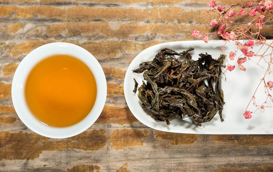 Pu-erh tea in cup and Pu-erh tea leaves