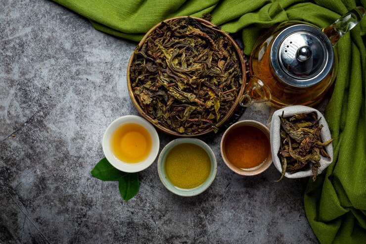 Green tea in a cup with leaves