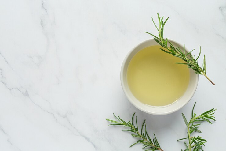 Green tea in cup with leaves