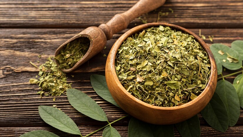 Green tea leaves in cup