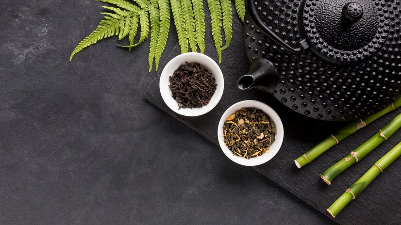 Tea pot and Cups with Pu-erh tea leaves